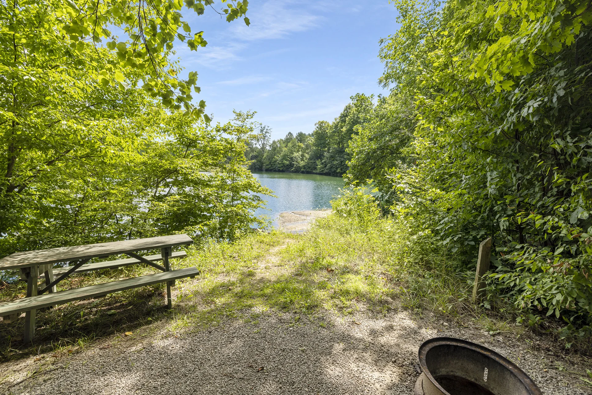 picnic bench with view of pond